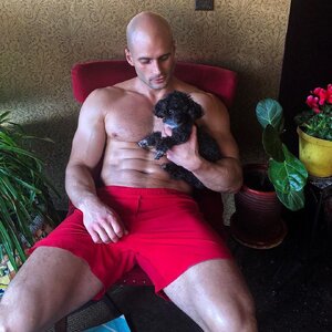 fit-bald-shirtless-hairy-daddy-masculine-dilf-huge-thighs-holding-puppy-dog.jpg