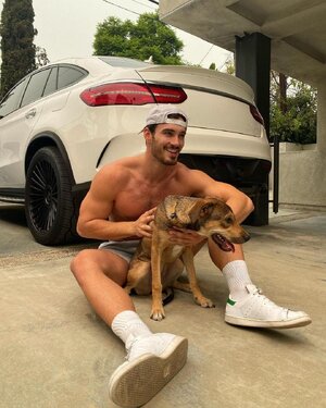 handsome-male-model-michael-yerger-smiling-petting-dog-white-cap-socks-sneakers-car.jpg