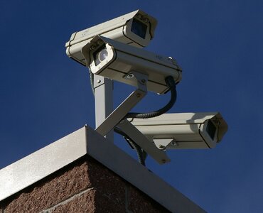 1200px-Three_Surveillance_cameras.jpg