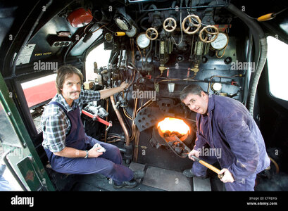 fireman in-the-cab-of-southern-railway-steam-locomotive-CTRDXG.jpg