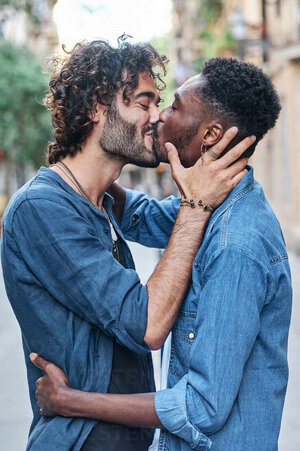 gay-couple-with-eyes-closed-kissing-each-other-AGOF00144.jpg