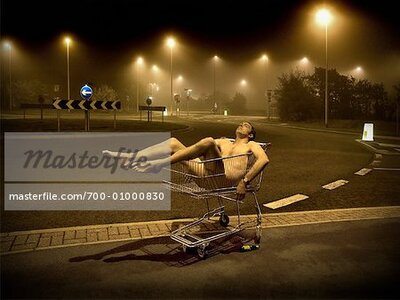 700-01000830em-naked-man-in-shopping-cart-stock-photo.jpg