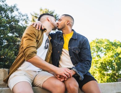 portrait-happy-gay-couple-spending-time-together-kissing-park-lgbt-love-concept_58466-11444.jpg