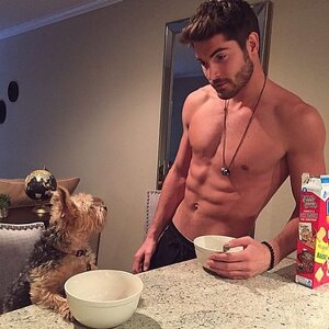 19-shirtless-man-staring-at-puppy.jpg