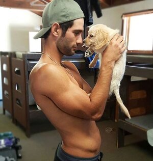 20-shirtless-man-holding-retriever.jpg