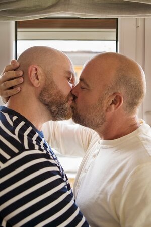 side-view-queer-partners-kissing-home_23-2149887596.jpg