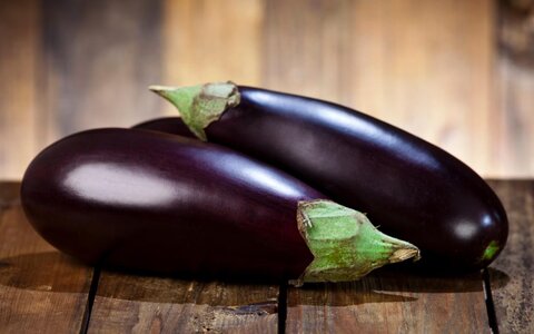 two-eggplants-on-a-wooden-table.jpg