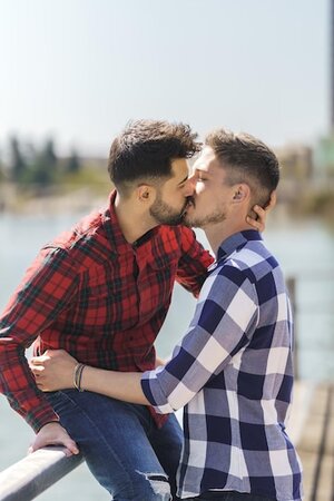 vertical-photo-gay-couple-kissing-jetty_475667-2333.jpg