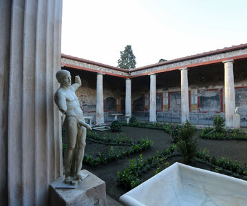 3. House of the Vettii, Pompeii, with Priapus statue.jpg