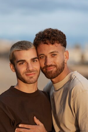 gay-couple-spending-time-together-beach_23-2150168298.jpg