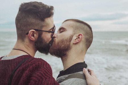 gay-couple-kissing-in-front-of-the-sea-RTBF00742.jpg