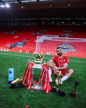 Mo Salah with the PL trophy and his individual awards.jpg