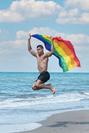 8. man-holding-rainbow-flag-jumping.jpg