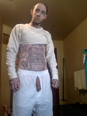 tattoed convict-big cock-in-jail (1).jpg