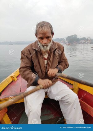 old-man-rowing-boat-indian-stress-beautiful-scenario-behind-173140069.jpg