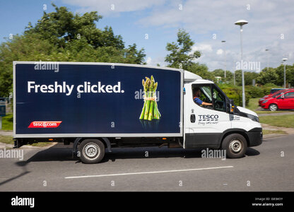 tesco-online-delivery-vehicle-freshly-clicked-tomato-livery-supermarket-G83A5Y.jpg