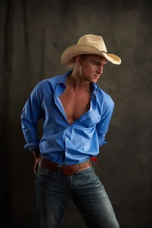 depositphotos_198859244-stock-photo-sexy-cowboy-poses-camera.webp