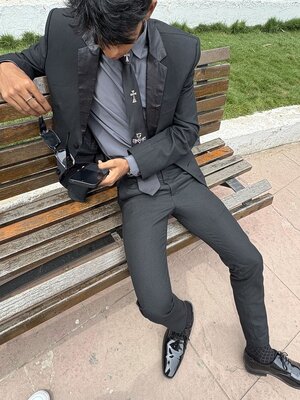 Guy in a black suit.jpeg