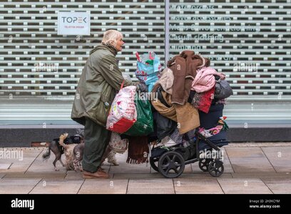 homeless-bag-lady-in-preston-lancashire-oct-2021-a-homeless-woman-who-roams-the-streets-of-the...jpg