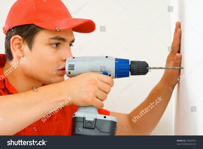 stock-photo-a-man-drilling-a-hole-in-the-wall-25664593.jpg