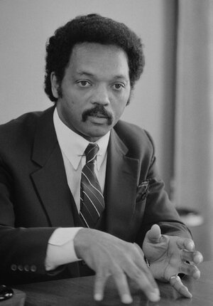 Jesse_Jackson,_half-length_portrait_of_Jackson_seated_at_a_table,_July_1,_1983_edit.jpg
