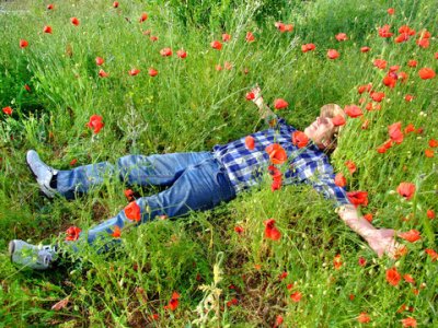 2744009-948583-man-lying-on-a-poppy-meadow.jpg