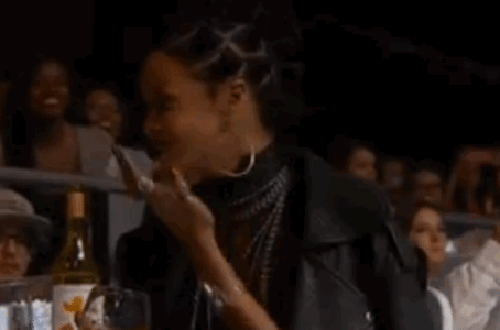 rihanna-laughing-at-ariana-grande.gif