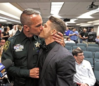 Detective David Currie, 50, and his now-husband Aaron Woodard, 33, tied the knot shortly after m.jpg Detective David Currie, 50, and his now-husband Aaron Woodard, 33, tied the knot shortly after m.jpg