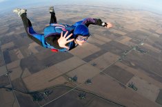 stock-photo-14892331-young-lady-skydiving-whilst-mid-air-waving-to-camera.jpg