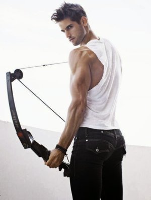 gay-archer-boy-ready-shot-muscle-shirt-bulging-shoulder-tight-butt-jeans-straps-drawn-bow-arrow-.jpg