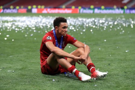 Trent Alexander-Arnold sitting on the pitch.jpg