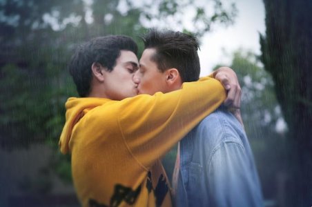 Men kissing in the rain.jpg