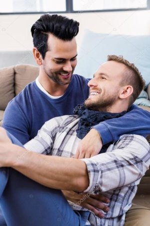 depositphotos_98112304-stock-photo-gay-couple-hugging-on-couch.jpg