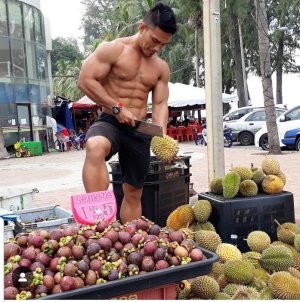 man cutting durian fruit.jpg
