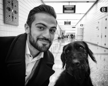 Jeremy Diamond gets some grooming tips from the sniffer dog (Sioux City IA).jpg