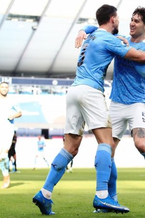 MANCHESTER-ENGLAND-FEBRUARY-27-Ruben-Dias-of-Manchester-City-celebrates-with-John-Stones-after-s.jpg