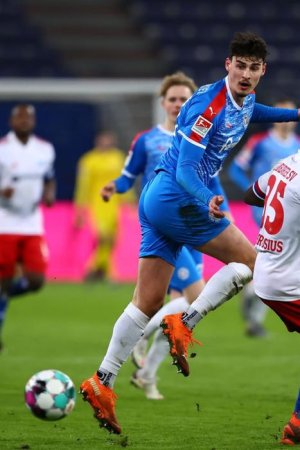 HAMBURG-GERMANY-MARCH-08-Janni-Serra-of-Holstein-Kiel-and-Stephan-Ambrosius-of-Hamburger-SV-batt.jpg