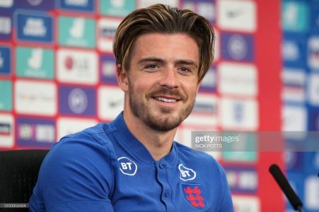 England-s-striker-Jack-Grealish-smiles-during-a-press-conference-at-the-St-George-s-Park-stadium.jpg