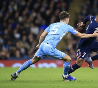MANCHESTER-ENGLAND-NOVEMBER-24-John-Stones-of-Man-City-chases-Kylian-Mbappe-of-PSG-during-the-UE.jpg