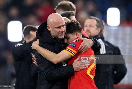 Wales-interim-head-coach-Rob-Page-L-hugs-Wales-midfielder-Daniel-James-after-during-the-FIFA-Wor.jpg