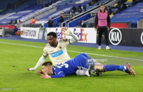 LEICESTER-ENGLAND-DECEMBER-10-Luke-Thomas-of-Leicester-City-in-action-with-Levi-Garc-a-of-AEK-At.jpg
