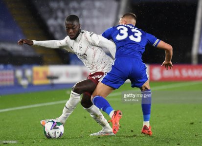 LEICESTER-ENGLAND-SEPTEMBER-23-Nicolas-Pepe-of-Arsenal-turns-away-from-Luke-Thomas-of-Leicester-.jpg