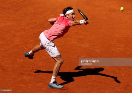 MADRID-SPAIN-MAY-04-Casper-Ruud-of-Norway-stretches-for-a-backhand-in-his-mens-singles-match-aga.jpg